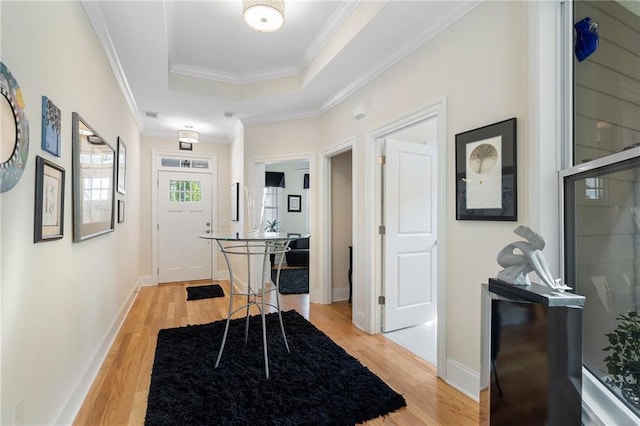 interior space with light wood-type flooring and crown molding