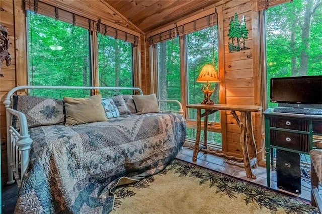 sunroom / solarium with lofted ceiling and wooden ceiling