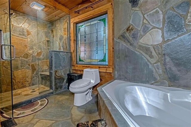 bathroom with wood ceiling, toilet, shower with separate bathtub, beamed ceiling, and tile walls