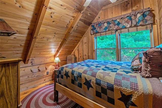 bedroom featuring wood walls, ceiling fan, lofted ceiling with beams, and wooden ceiling