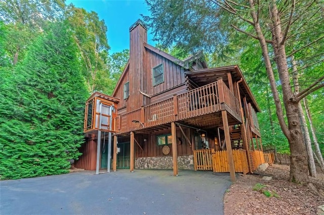 view of front facade featuring a deck and a carport