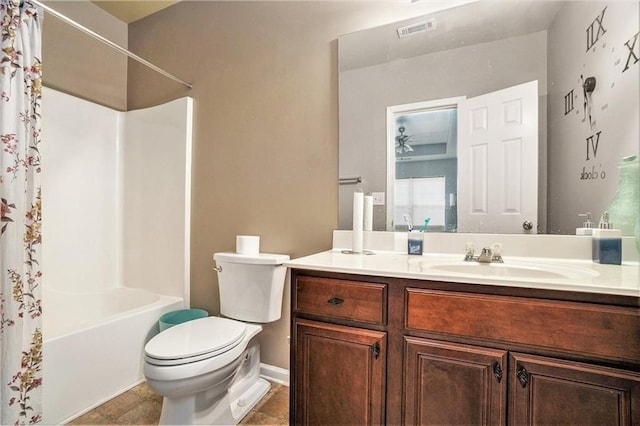 full bathroom featuring toilet, vanity, visible vents, tile patterned floors, and shower / bath combination with curtain