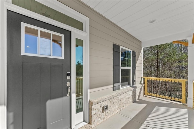 property entrance with covered porch