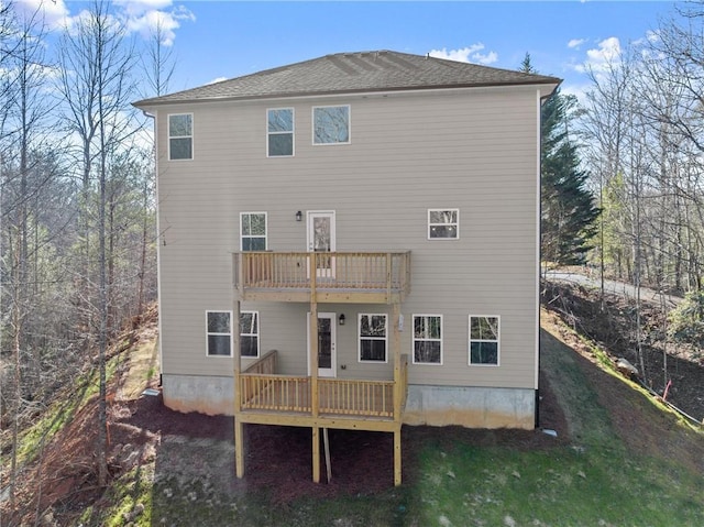 rear view of house with a balcony