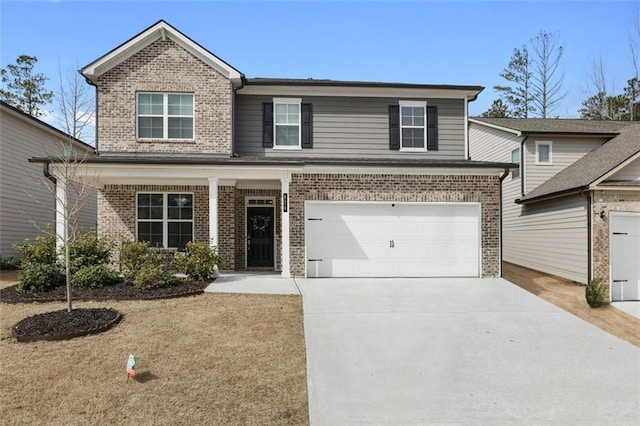 view of front of house with brick siding, driveway, and an attached garage