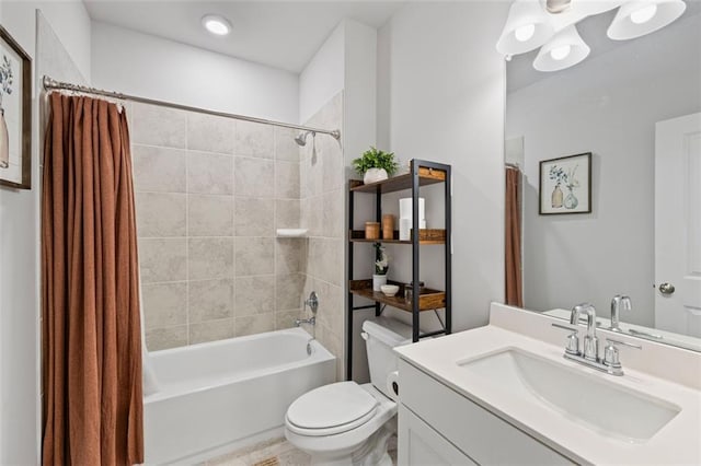 full bath featuring vanity, toilet, and shower / bath combo