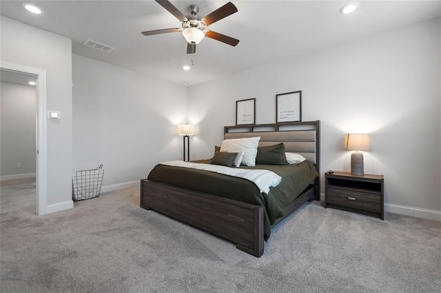 carpeted bedroom with a ceiling fan, recessed lighting, visible vents, and baseboards