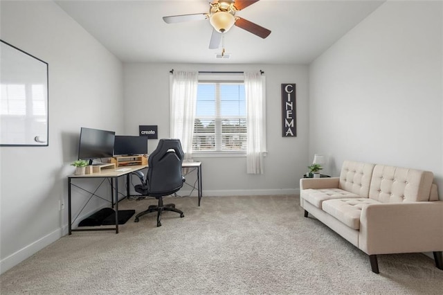 office space featuring baseboards, carpet floors, visible vents, and ceiling fan