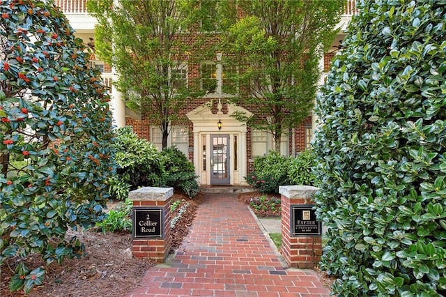 entrance to property with brick siding