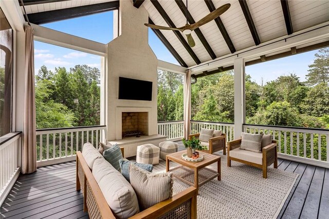 3773 Randall Rd SE, Atlanta, GA 30339 - wooden deck featuring an outdoor living space with a fireplace, ceiling fan, and view of wooded area