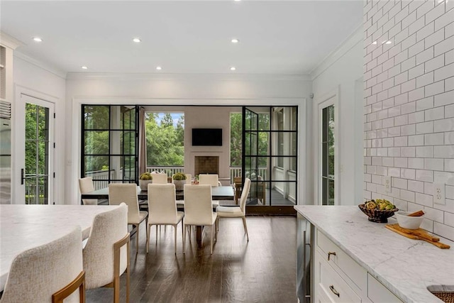 3773 Randall Rd SE, Atlanta, GA 30339 - dining space featuring crown molding, healthy amount of natural light, dark wood-type flooring, and recessed lighting