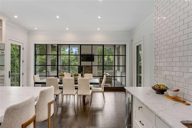 3773 Randall Rd SE, Atlanta, GA 30339 - dining space with dark wood-type flooring, crown molding, and recessed lighting
