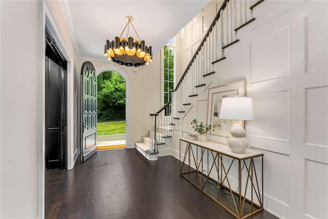 3773 Randall Rd SE, Atlanta, GA 30339 - entryway featuring a chandelier, stairs, wood finished floors, and baseboards