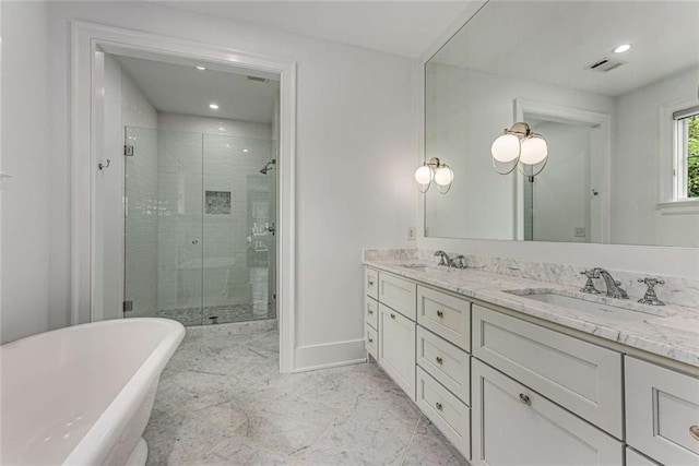 3773 Randall Rd SE, Atlanta, GA 30339 - bathroom with a stall shower, double vanity, a freestanding bath, baseboards, and recessed lighting