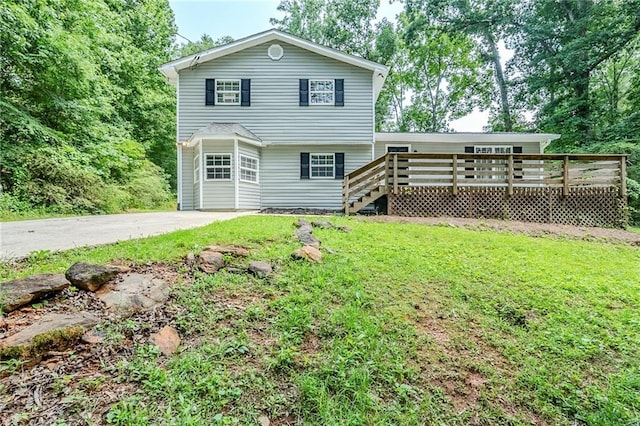 270 Hunt Ridge Dr, Stockbridge, GA 30281 - rear view of property featuring a wooden deck and a lawn
