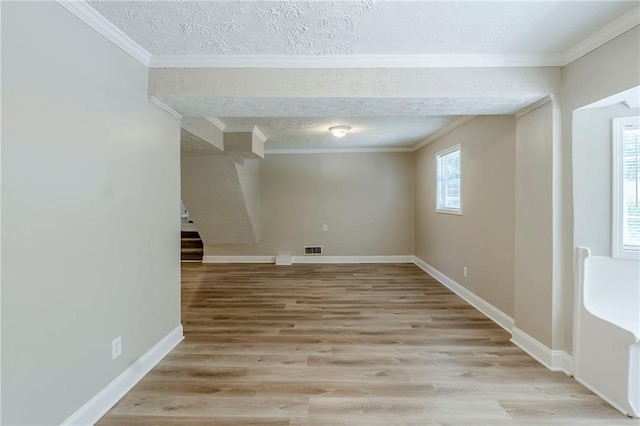 270 Hunt Ridge Dr, Stockbridge, GA 30281 - empty room with light wood finished floors, crown molding, baseboards, and a textured ceiling