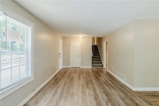 270 Hunt Ridge Dr, Stockbridge, GA 30281 - empty room with stairs, light wood-style flooring, and baseboards