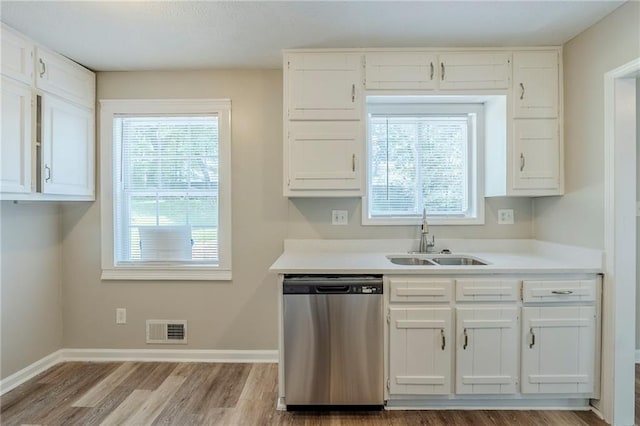 270 Hunt Ridge Dr, Stockbridge, GA 30281 - kitchen with dishwasher, a sink, white cabinetry, and wood finished floors