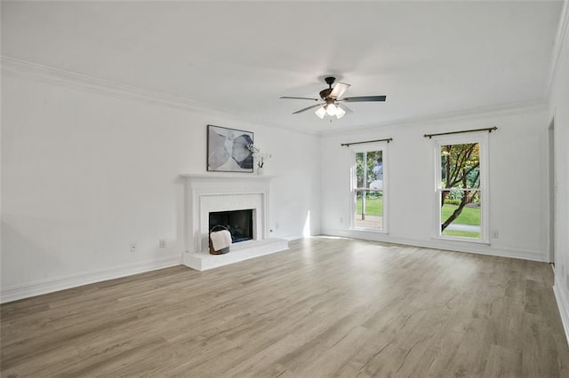 2316 Fripp Overlook NW, Acworth, GA 30101 - unfurnished living room featuring a ceiling fan, a brick fireplace, wood finished floors, and crown molding