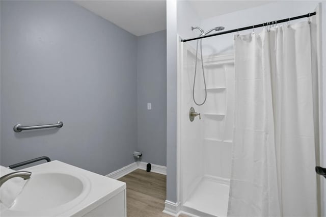 2316 Fripp Overlook NW, Acworth, GA 30101 - bathroom with a shower with shower curtain and wood finished floors