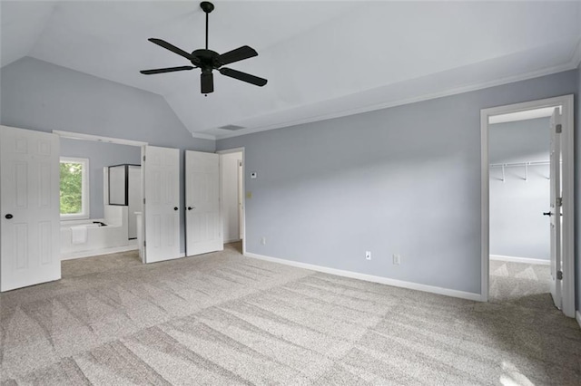 2316 Fripp Overlook NW, Acworth, GA 30101 - unfurnished bedroom with lofted ceiling, carpet, a walk in closet, ceiling fan, and a closet