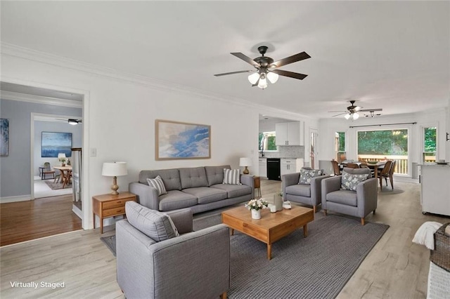 2316 Fripp Overlook NW, Acworth, GA 30101 - living area featuring ceiling fan, healthy amount of natural light, light wood-type flooring, and ornamental molding