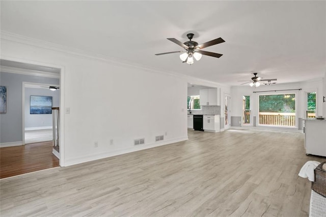 2316 Fripp Overlook NW, Acworth, GA 30101 - unfurnished living room featuring ceiling fan, ornamental molding, and light wood-style flooring