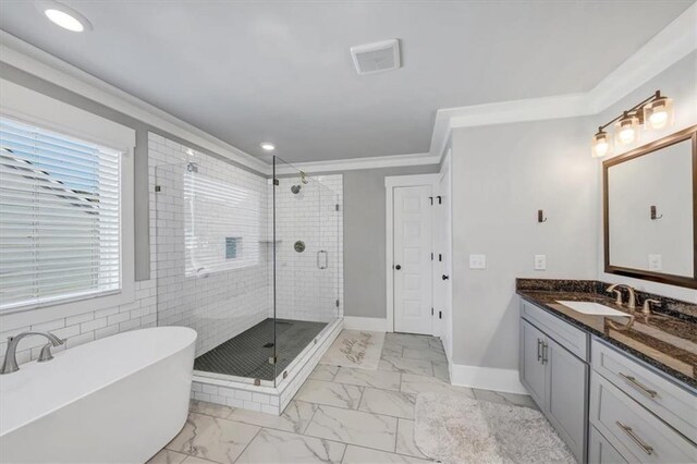 carpeted bedroom with ceiling fan, ornamental molding, and a raised ceiling