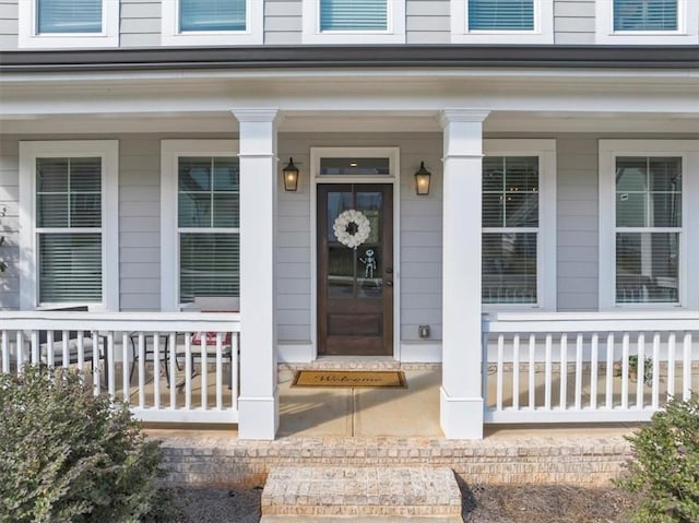 property entrance featuring covered porch