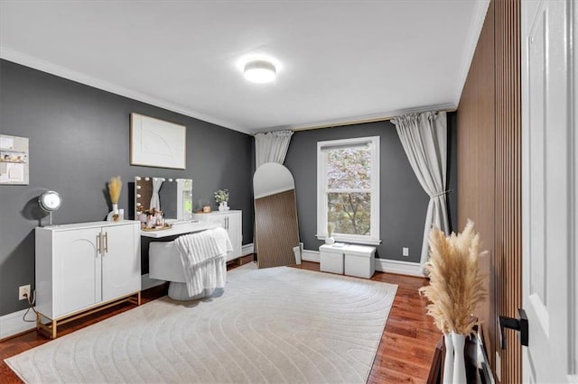 office featuring ornamental molding, baseboards, and wood finished floors