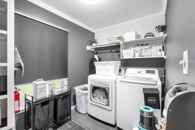 laundry area with independent washer and dryer and ornamental molding