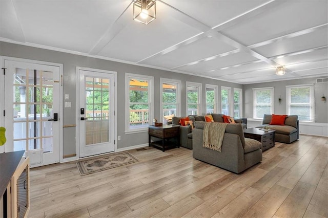 living room featuring coffered ceiling, light wood-style floors, baseboards, and beamed ceiling