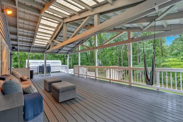 wooden terrace featuring view of scattered trees