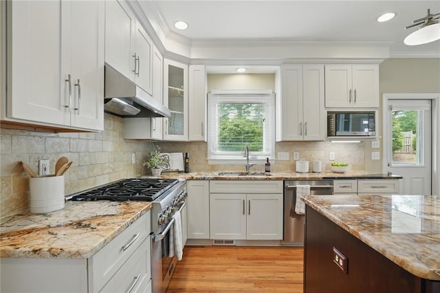 2802 Arabian Trl NE, Marietta, GA 30062 - kitchen with a sink, stainless steel appliances, under cabinet range hood, ornamental molding, and white cabinets
