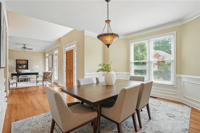 2802 Arabian Trl NE, Marietta, GA 30062 - dining space featuring light wood-type flooring, crown molding, a wainscoted wall, and a ceiling fan