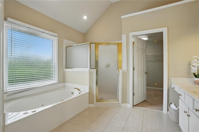 2802 Arabian Trl NE, Marietta, GA 30062 - bathroom featuring vanity, a whirlpool tub, a stall shower, vaulted ceiling, and tile patterned flooring