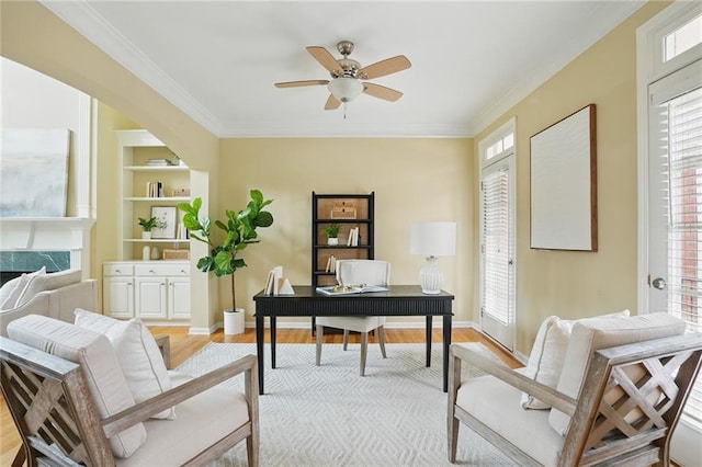 2802 Arabian Trl NE, Marietta, GA 30062 - home office with light wood-style floors, ceiling fan, ornamental molding, baseboards, and built in shelves