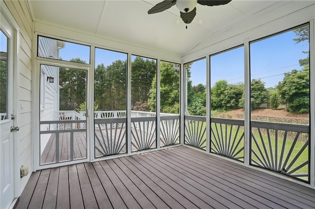 2802 Arabian Trl NE, Marietta, GA 30062 - unfurnished sunroom with ceiling fan, lofted ceiling, and view of wooded area