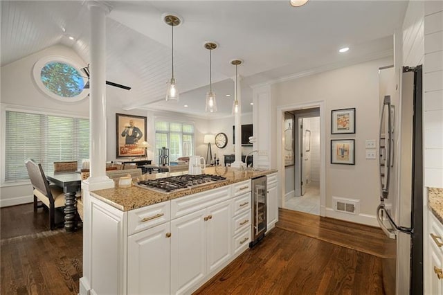 kitchen with visible vents, dark wood-style flooring, stainless steel appliances, wine cooler, and white cabinetry