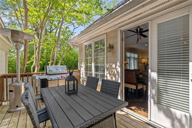 deck with area for grilling and outdoor dining area