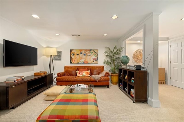 carpeted living area featuring recessed lighting, visible vents, and ornamental molding