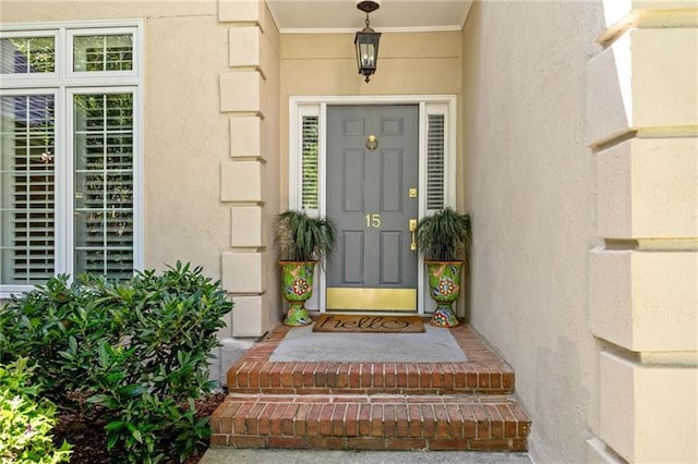 doorway to property with stucco siding