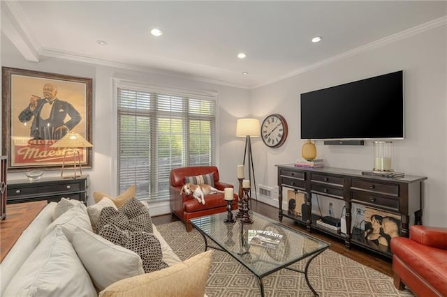 living room featuring visible vents, wood finished floors, and ornamental molding