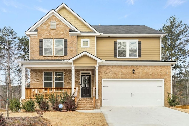 craftsman-style house featuring a garage and a porch