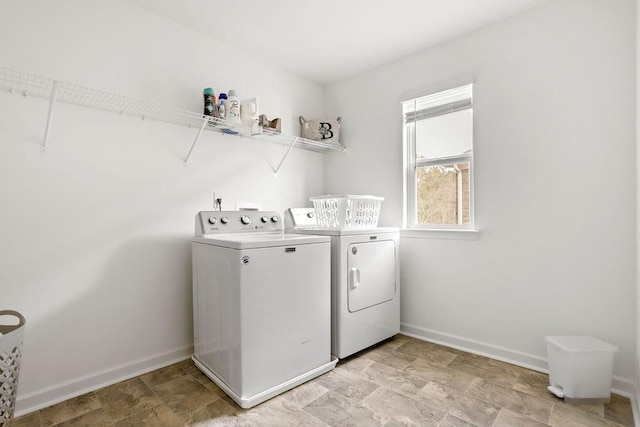 laundry room with washing machine and clothes dryer