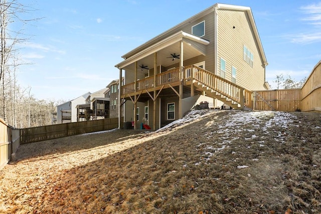 back of property featuring ceiling fan