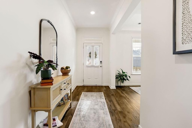 entrance foyer featuring crown molding and dark hardwood / wood-style floors