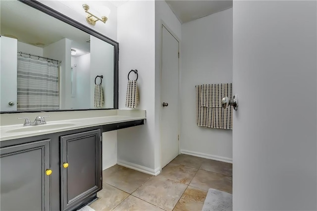 bathroom with vanity and tile patterned flooring