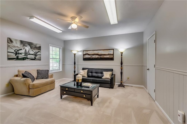 living room featuring light colored carpet and ceiling fan