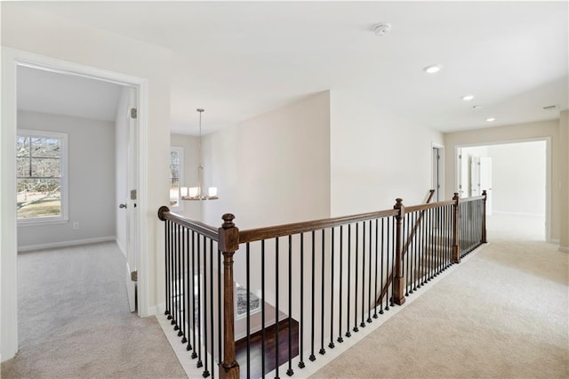 5997 Creek Indian Dr, Sugar Hill, GA 30518 - hall with an upstairs landing, carpet floors, a chandelier, and recessed lighting